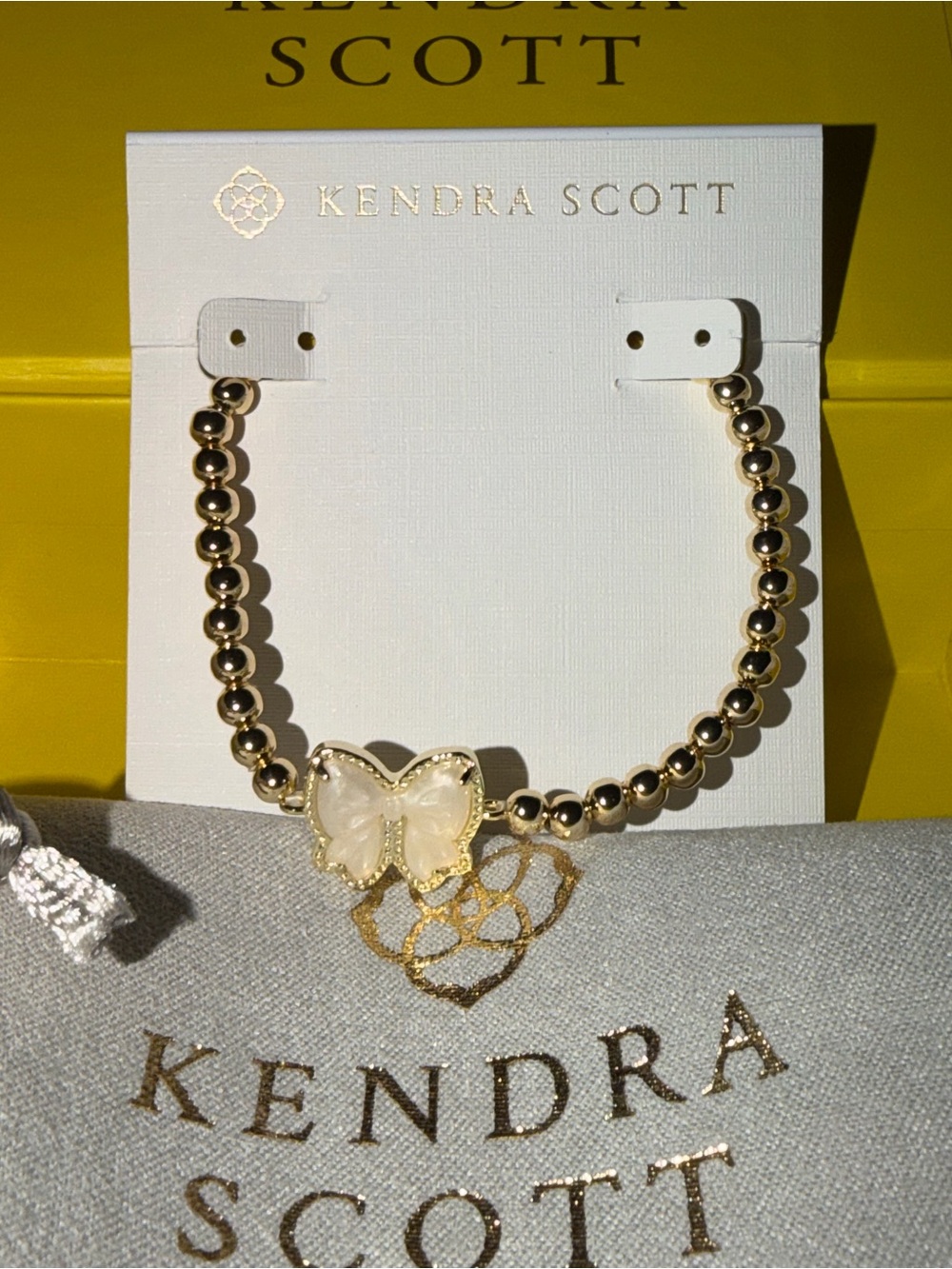 Kendra Scott Gold Beaded Bracelet with White Bow Charm